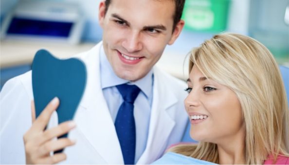 Dentist consulting with a patient.